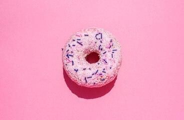 Studio shot of sweet doughnut with sugar sprinkles