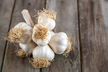 bunch of garlic on a wooden table