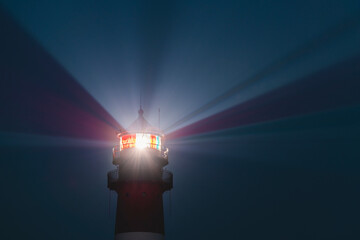 Germany, Schleswig-Holstein, Westerhever, Top of Westerheversand Lighthouse glowing at dusk