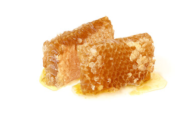 Tasty honey in honeycombs isolated on white