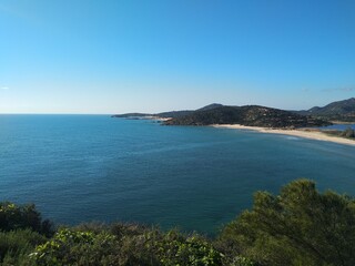 Mediterranean seascape, coastline and turquoise water from Chia tower in Sardinia, Italy 