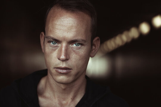 Close-up Of Man With Gray Eyes In Tunnel