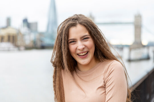Beautiful young woman laughing while spending leisure time in city, London, UK