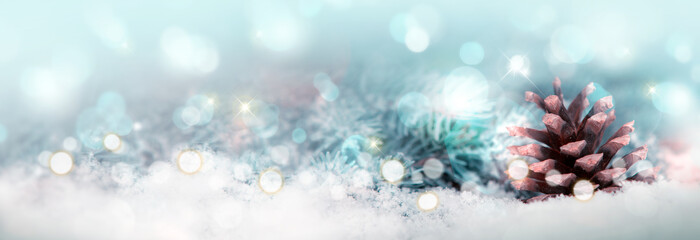 Fototapeta na wymiar Christmas background with fir tree cone and snow.Glitter vintage lights background.