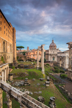 View of Colosseum and Roman Forum against cloudy sky