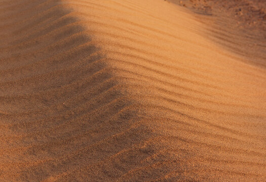 Sand background. Dunes background. Sandy dunes texture. Kalur, Iran. Sunset light