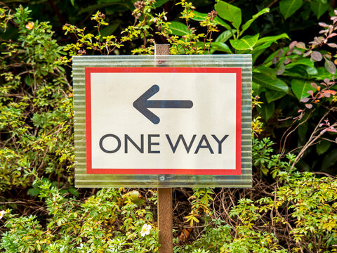 One way sign in a garden to encourage social distancing
