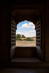 a beautiful view of blue clouds and a village from the window of Amarsagar temple jaisalmer,rajasthan,india