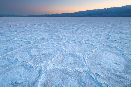 View of salt flat against mountain in Death valley