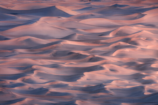 View of sand dunes during sunrise in Death Valley National Park