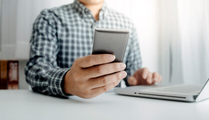 businesswoman hand using smart phone, tablet payments and holding credit card online shopping, omni channel, digital tablet docking keyboard computer at office in sun light