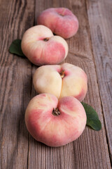 Fresh sweet fig peaches on wooden background