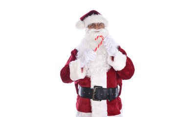 Senior man in traditional Santa Claus costume holding a candy cane in both hands. Isolated on white.