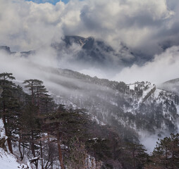 mount slope in a snow in a dense clouds