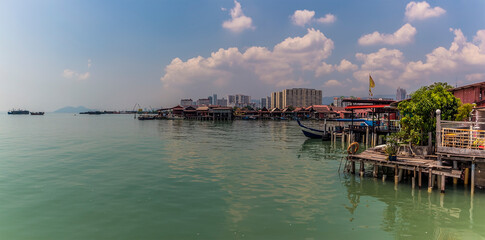 Peaceful waters surround the clan jetties in George Town, Penang Island, Malaysia, Asia