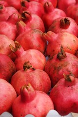Ripe juicy pomegranates on the market macro 