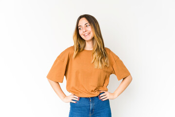 Young caucasian woman isolated on white background confident keeping hands on hips.