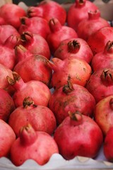 Ripe juicy pomegranates on the market macro 