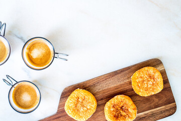 Beans and almonds pastries with espressos copy space