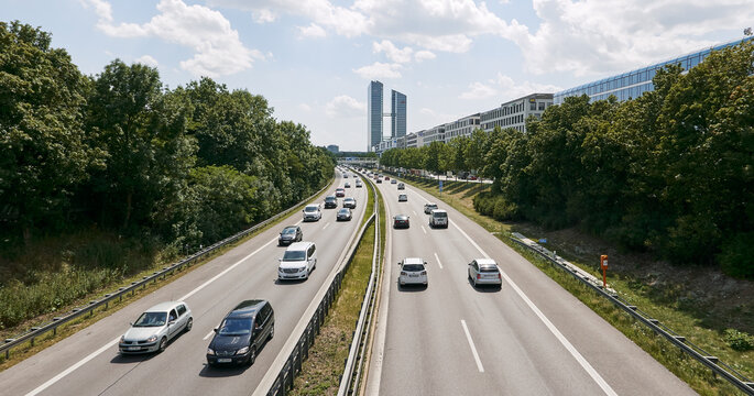 View of a modern motor road with cars in the city of Munich
