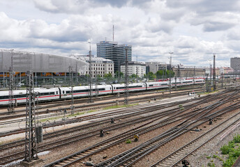 Fototapeta premium view of railway tracks with modern trains in Munich
