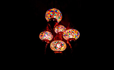 Beautiful vintage luxury light bulb hanging decor glowing in dark.