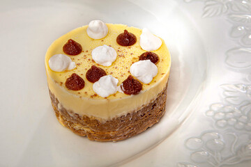 sweet ice cream with cream and chocolate on a white plate