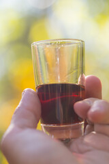 man holding wine glass in a fingers