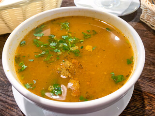 Hot spicy soup kharcho in white tureen, Georgian cuisine