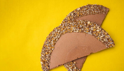 Wafers or joy, chocolate-colored, on a yellow background, Mexican sweets