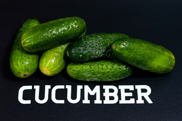 In the center of the screen, a closeup image shows a pile of fresh green cucumbers.