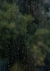 raindrops on window glass. summer background. selective focus.