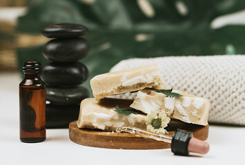 handmade soap made from squeezing soap slivers, pyramid of stones and oil, the concept of spa and self-care at home