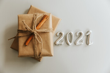 Christmas Scene. Holiday Greeting Card Design. Candle Background. New Year 2021 concept on white background. Rustic staly with christmas box.