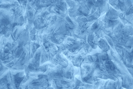 Blue ice background. Frozen water. © kobzev3179