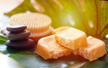 handmade soap made from squeezing soap slivers, pyramid of stones and oil, the concept of spa and self-care at home