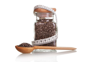 Chia seeds healthy food. Slimming concept. Glass jar and meter t - obrazy, fototapety, plakaty