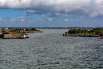 Fototapeta na wymiar View from cruise ferry heading to Helsinki and approaching the Suomenlinna (fin. Castle of Finland) fortress (Sveaborg - Castle of the Swedes, swed), Finland. It consists of eight islands.