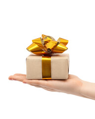Gift with golden bows in a woman's hand.