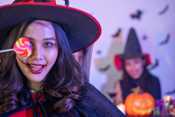 young Asian woman wearing costume in Halloween festival party