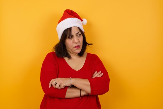 Closeup portrait displeased pissed off angry grumpy pessimistic woman with bad attitude, arms crossed looking sideways. Negative human emotion facial expression feelings