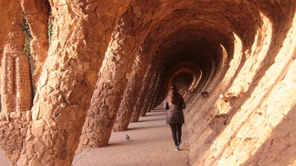 Woman walking in the park Güell, Barcelona