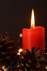 Red christmas candle with decorations. Christmas background 