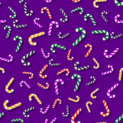 Pattern of multicolored Christmas lollipop on a purple background. New year and christmas illustration. The template is suitable for posters, cards, fabrics or wrapping paper