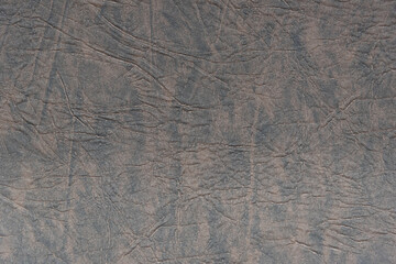 Fragment of a sheet of genuine leather. Background. Texture.
