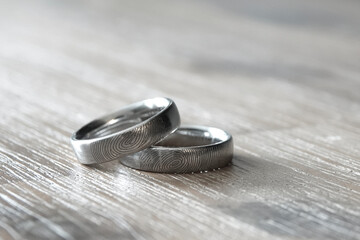 close up photography of wedding ring with fingerprint detail. special rings, forever,  love