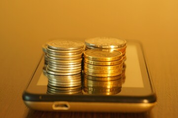 A stack of coins on your mobile phone.