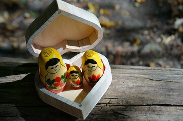 Matryoshka figures and a heart-shaped box.