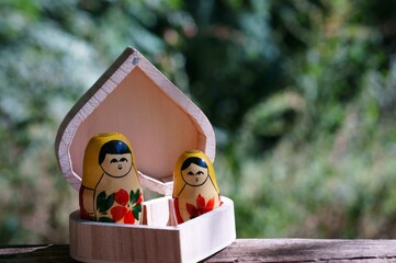 Matryoshka figures and a heart-shaped box.