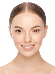 Vertical portrait of young beautiful smiling woman with naked shoulders and naturally glowing skin, isolated on white background